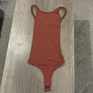 Double layered cross back Express bodysuit.